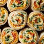 Vegetable Tortilla Roll Ups filled with colorful vegetables and herbs.