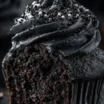 Delicious black velvet cupcakes beautifully decorated with cream cheese frosting.