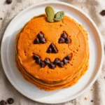 Delicious Jack-O-Lantern pancakes decorated for Halloween